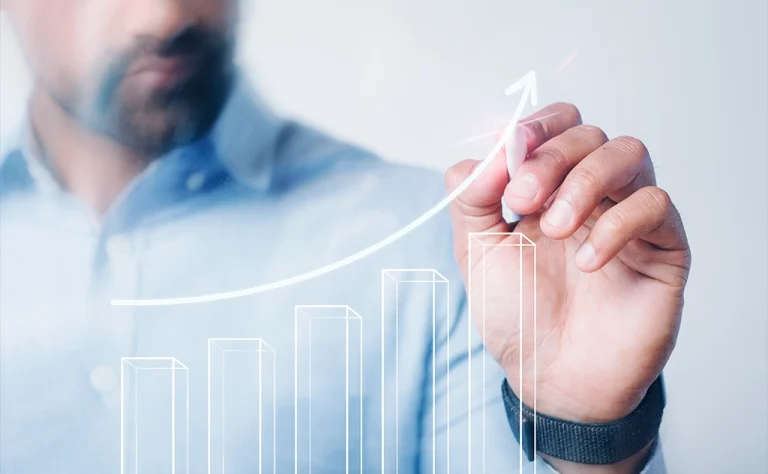 AIBN team member drawing a growth chart for business expansion.