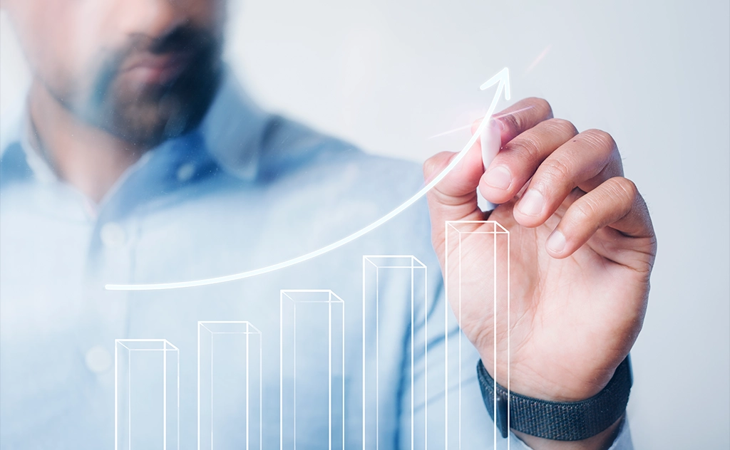 AIBN team member drawing a growth chart for business expansion.