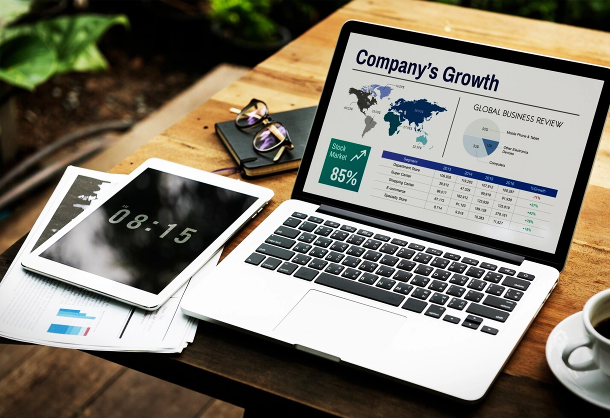 A laptop showing a global business review. AIBN's access to key business regions.