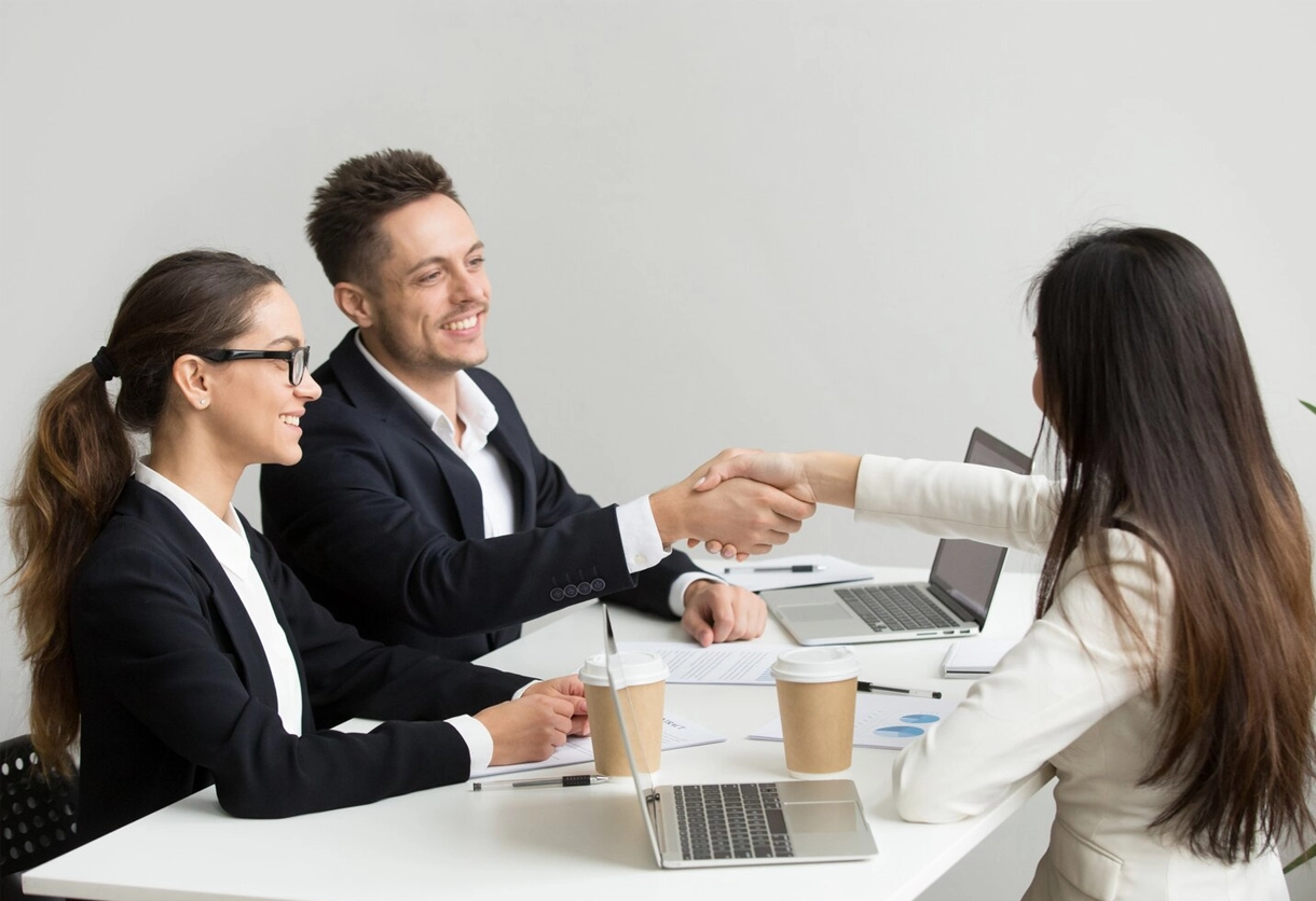 AIBN team handshake for a business partnership.