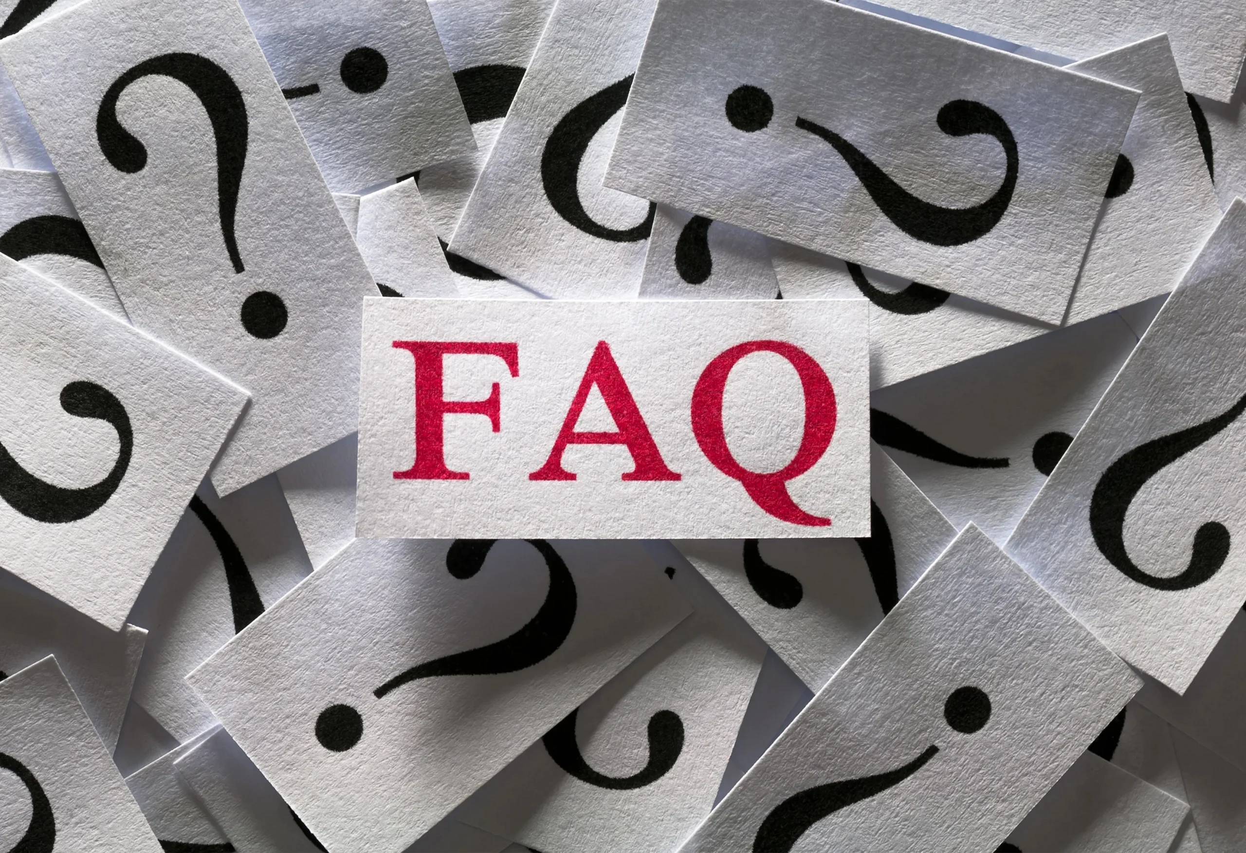 AIBN FAQ card among question mark icons for business advisory clarity.