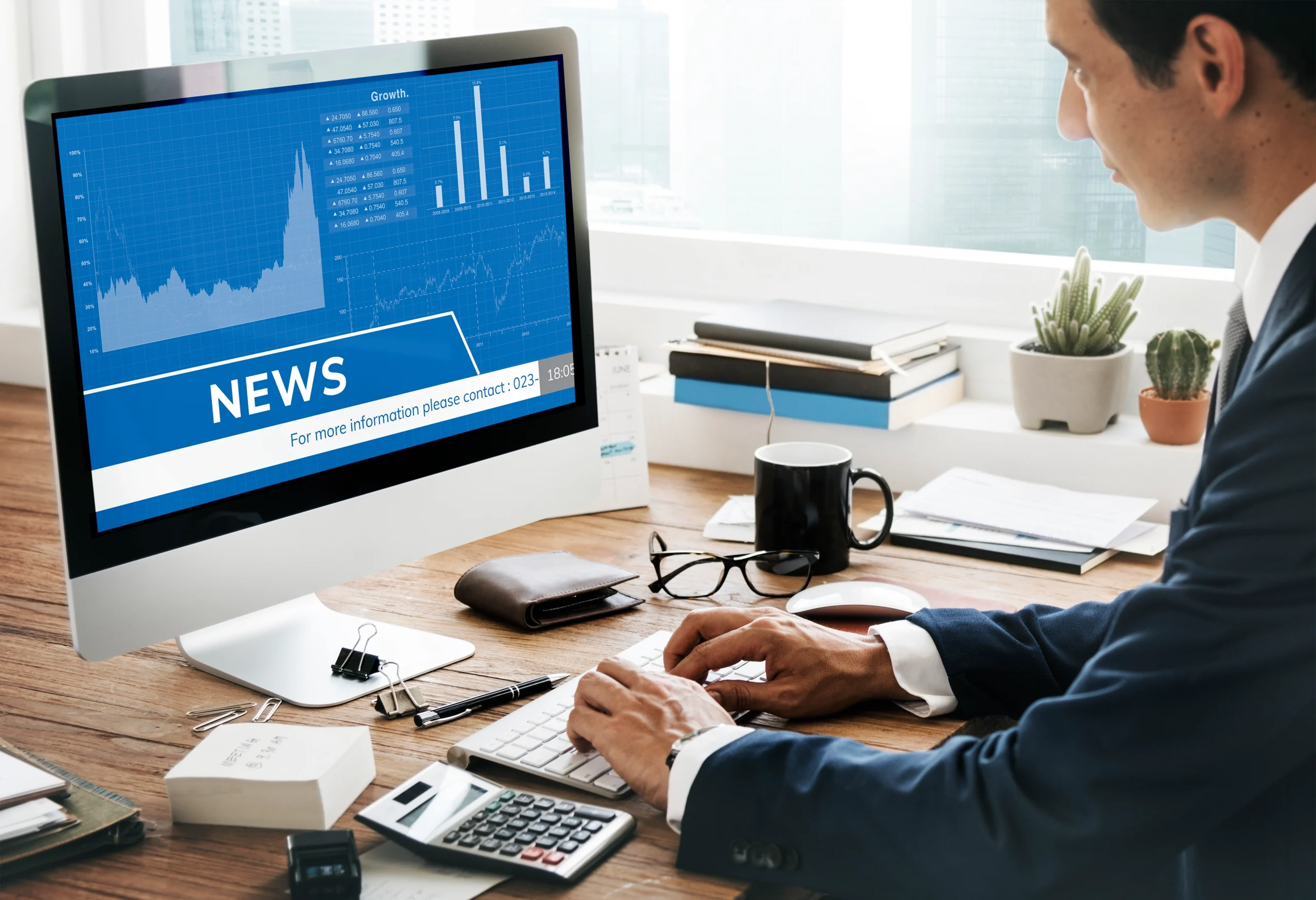 AIBN team member checking business news and announcements.