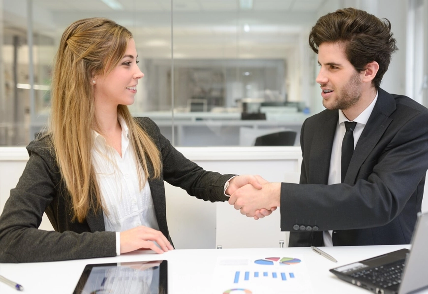AIBN team handshake for a business partnership.
