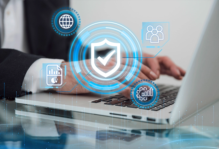 Laptop with shield graphic showing AIBN cybersecurity and data protection services.