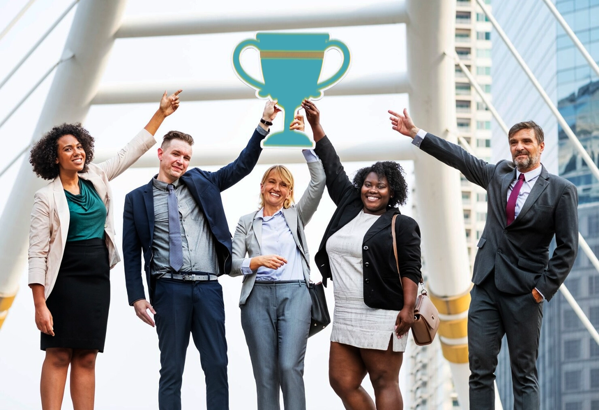 AIBN business team raising digital trophy outdoors, symbolizing shared achievement and strategic feasibility.