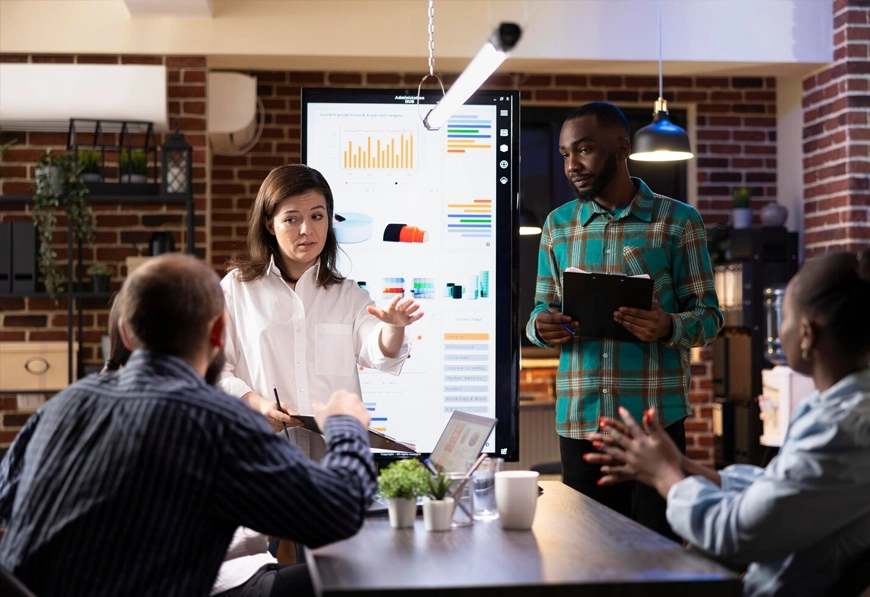 A diverse team working together, representing AIBN's strategic alliance and business collaboration