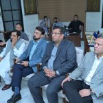 A group of business professionals from AIBN and partners at a business meeting.