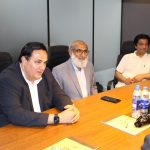 A group of business professionals from AIBN and partners at a business meeting.
