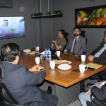 A group of business professionals from AIBN and partners at a business meeting.