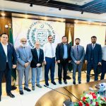 A group of business professionals from AIBN and the Drug Regulatory Authority of Pakistan (DRAP) at a meeting, symbolizing a partnership.