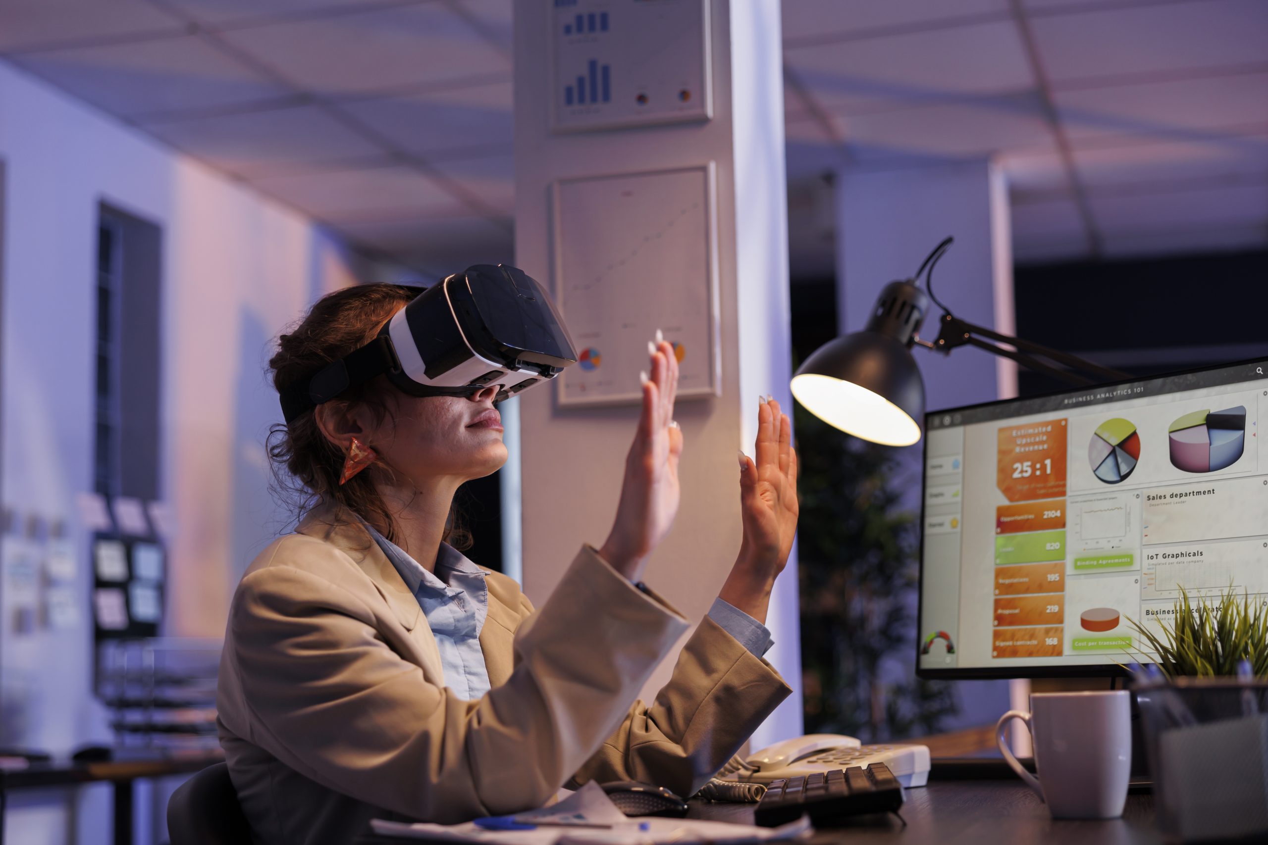 AIBN digital innovation with a woman using a VR headset for business planning.
